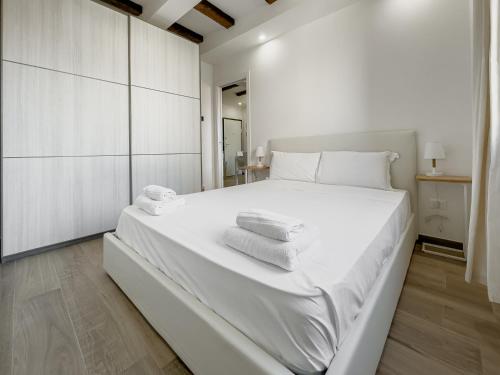 Tempat tidur dalam kamar di Realkasa Canonica Apartment