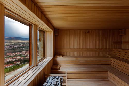 a sauna with a view of a city at Kayakapi Premium Caves Cappadocia in Urgup