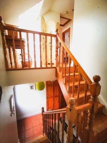an overhead view of a wooden staircase in a house at Orchard Cottage in Dingle