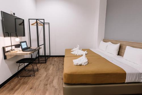 Ένα ή περισσότερα κρεβάτια σε δωμάτιο στο Urban Inn, Alor Setar