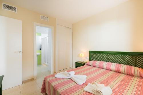 Ένα ή περισσότερα κρεβάτια σε δωμάτιο στο Apartamento Larimar - PlusHolidays