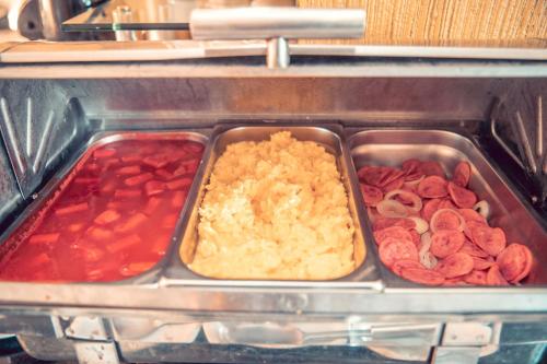 a tray of food with different types of food at STALO HOTEL in Piumhi