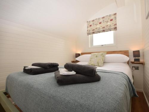 a bedroom with two beds and a window at 1 Bed in Teviothead 75346 in Hawick