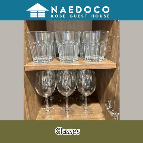 a group of wine glasses sitting on a shelf at LN14 なえどこハウス 2023年末オープン!三宮新神戸徒歩10分! 2LDK house in Fukiaichō