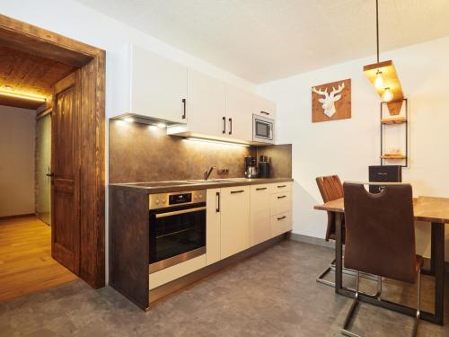 Kuchyň nebo kuchyňský kout v ubytování Wildbach Apartments STUBAI - NEW APARTMENTS