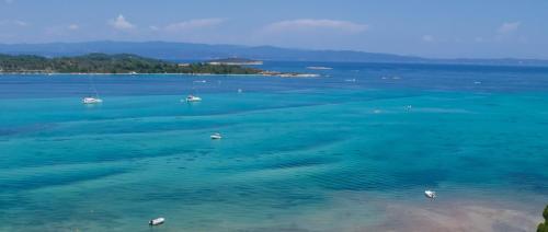 an aerial view of a large body of water with boats at Epavli Alexandros Luxury Villa in Vourvourou