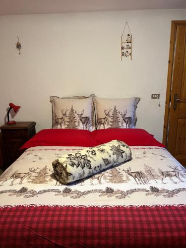 En eller flere senge i et værelse på La Maison del Ru - CIR VDA GIGNOD 0037