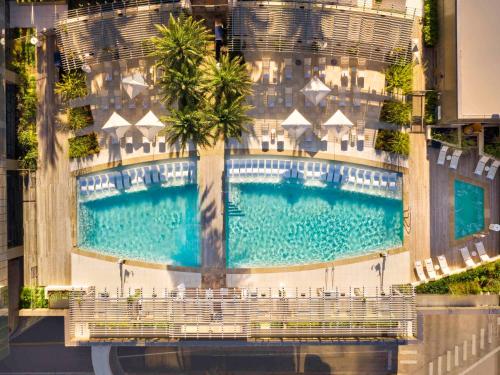 an overhead view of a building with a swimming pool at Fairmont Austin in Austin