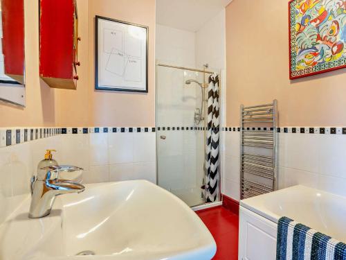 a bathroom with a sink and a shower at 4 Bed in Glasbury 80464 in Glasbury