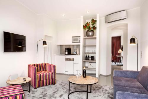 a living room with a couch and a chair at Lux 11 Berlin-Mitte in Berlin