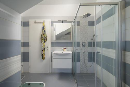 a bathroom with a sink and a shower at Villa Lana by IstriaLux in Vodnjan