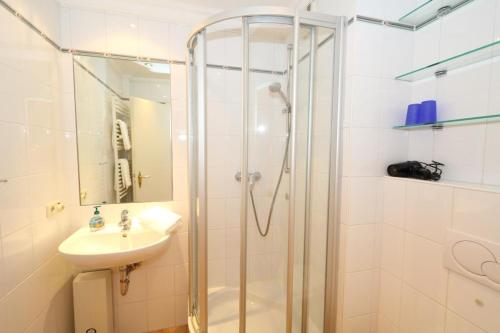 a bathroom with a shower and a sink at App. Hackmack 62 in Westerland