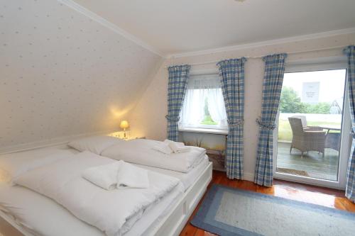 Ένα ή περισσότερα κρεβάτια σε δωμάτιο στο Haus Krauthahn DG