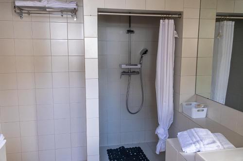 a bathroom with a shower with a shower curtain at Bea&Berto - B&B - in Trebbiantico