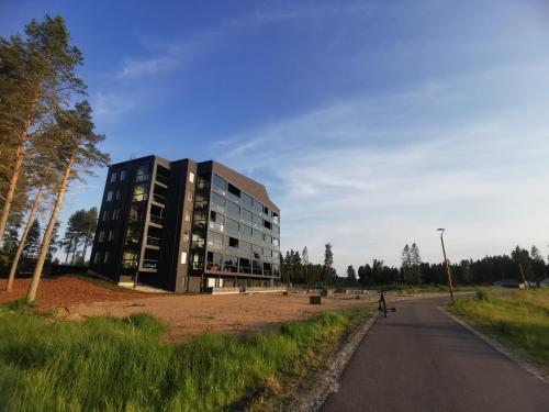 a large building on the side of a road at Apartment Beach & Golf Kalajoki in Kalajoki