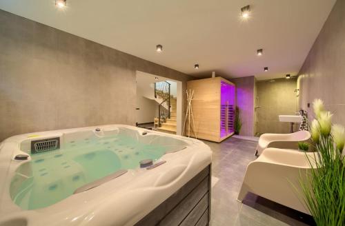 a large bathroom with a jacuzzi tub at Villa Valle in Sveti Vid-Miholjice
