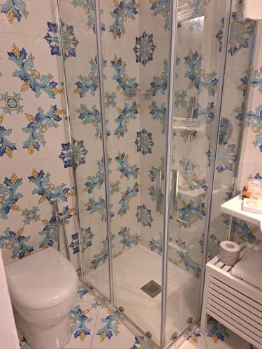 a bathroom with a shower and a toilet at Tre Re Appartamento Via Marina Grande,264 in Capri