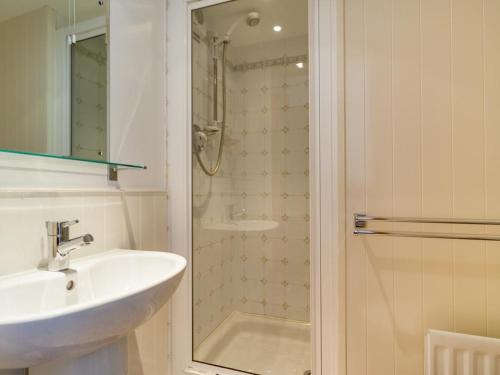a bathroom with a sink and a shower at 2 Bed in Patterdale SZ210 in Patterdale