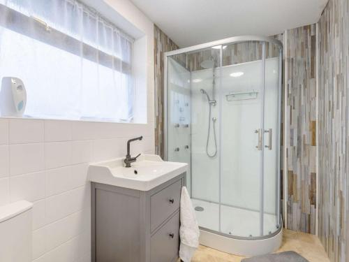 a bathroom with a shower and a sink at 2 Bed in Northwich 85877 in Kingsley