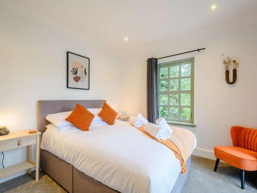 a bedroom with a bed and a desk and a window at 3 Bed in Kippford 88274 in Kippford