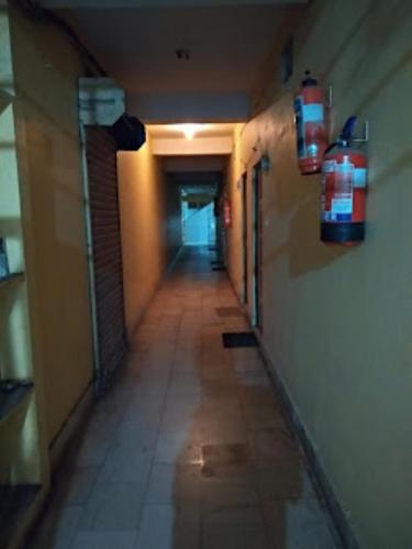 an empty hallway with a long hallwayngthngthngthngthngthngthngthngthngth at Hotel Crystal,Bhubaneswar in Bhubaneshwar
