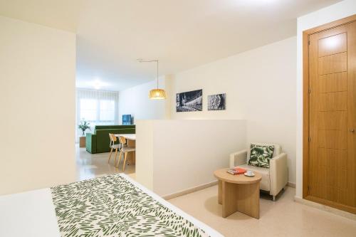 A bed or beds in a room at Pierre & Vacances Sevilla