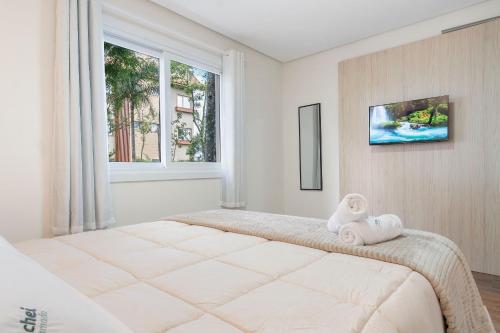 Postel nebo postele na pokoji v ubytování Toscano Cabernet 2 dorm by Achei Gramado