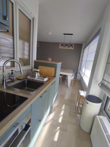 a kitchen with a sink and a counter top at Eaux Bulles Azur in Cagnes-sur-Mer