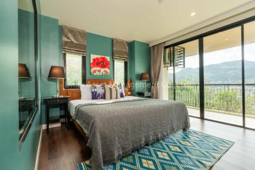 เตียงในห้องที่ The Unity and The Bliss Patong Residence
