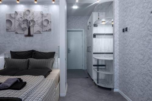 a bedroom with a bed and a walk in closet at Gudauri premium apartments in Gudauri