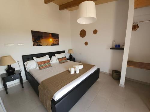 a bedroom with a large bed in a room at Agroturisme Es Racó De Maria in Maria de la Salut