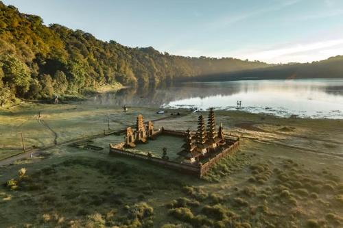 a large structure in the middle of a body of water at Munduk Sena in Munduk