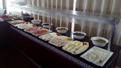 a buffet line with many different types of food at Sunday Beach Hotel in Kusadası