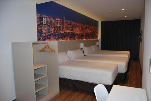 Katil atau katil-katil dalam bilik di Hotel BESTPRICE Gracia