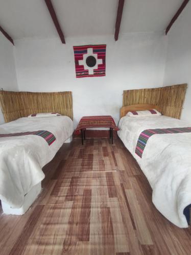 Katil atau katil-katil dalam bilik di INTI WASI LODGE