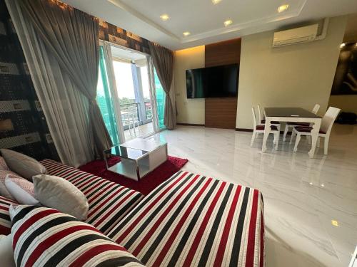 a living room with a couch and a table at Phuket Condominium Karon beach in Karon Beach