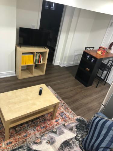 a living room with a couch and a coffee table at Home from Home! in Brampton