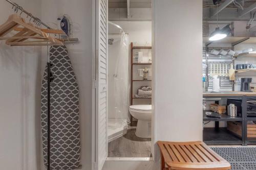 a bathroom with a shower with a toilet and a sink at Ultimate Man Cave Garage studio minutes to Whatever YOU do in Tampa