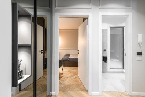 a room with a door leading to a bedroom at Luxury Apartment con FREE PARK in Trieste