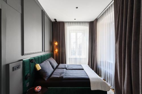 En eller flere senger på et rom på Luxury Apartment con terrazzo su Piazza Oberdan