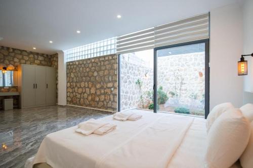 Ένα ή περισσότερα κρεβάτια σε δωμάτιο στο Villa Gulay - Kalkan Villa