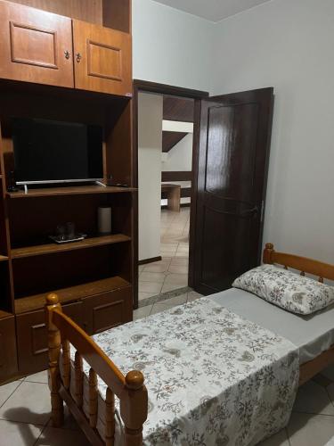 Кровать или кровати в номере Pousada cravo & canela