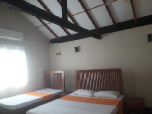 Ένα ή περισσότερα κρεβάτια σε δωμάτιο στο Ralapela Eco Bungalow