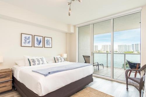 a bedroom with a bed and a large window at Marina Bay 46 in Miami Beach