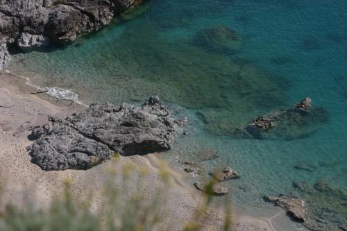 an aerial view of a beach with rocks and water at Residence Hotel Felix in Ricadi