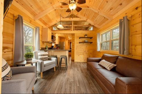 a living room with a couch and a kitchen at Jake Cabin Luxury Hot Tub Cabin Near Downtown in Chattanooga