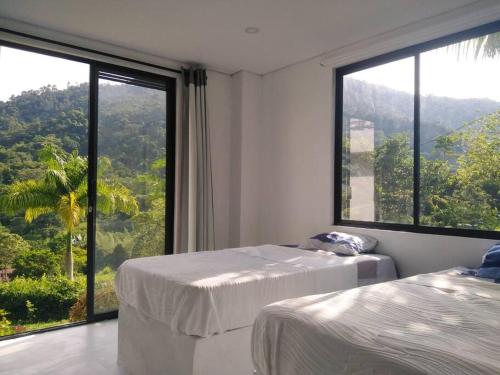 Postel nebo postele na pokoji v ubytování Acogedora Casa de campo en la Vega