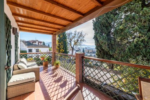 a balcony with a view of the mountains at Luminoso Alhambra View Suite - El Laurel in Granada