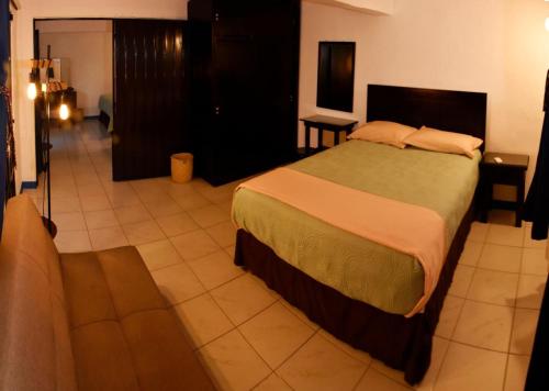 Giường trong phòng chung tại Casa Gris Alemán