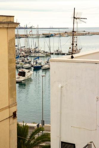 a view of a harbor with boats in the water at Palazzo Donnamaria in Manfredonia